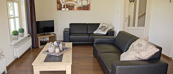 Limosa Wieringen - gezellige woonkamer Vakantiewoning Limosa Wieringen - de gezellige, tuingerichte woonkamer